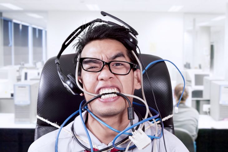 bigstock-Stress-Businessman-Biting-Cabl-44942689.jpg