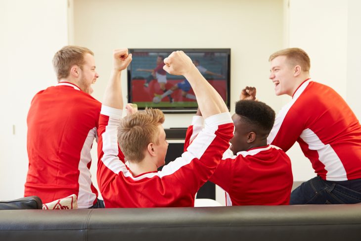 bigstock-Group-Of-Sports-Fans-Watching--63911890.jpg