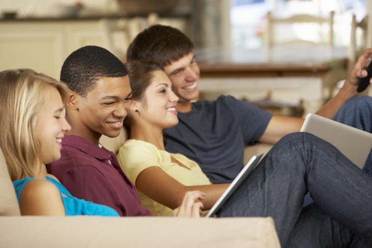 bigstock-Four-Teenagers-Sitting-On-Sofa-92341148.jpg