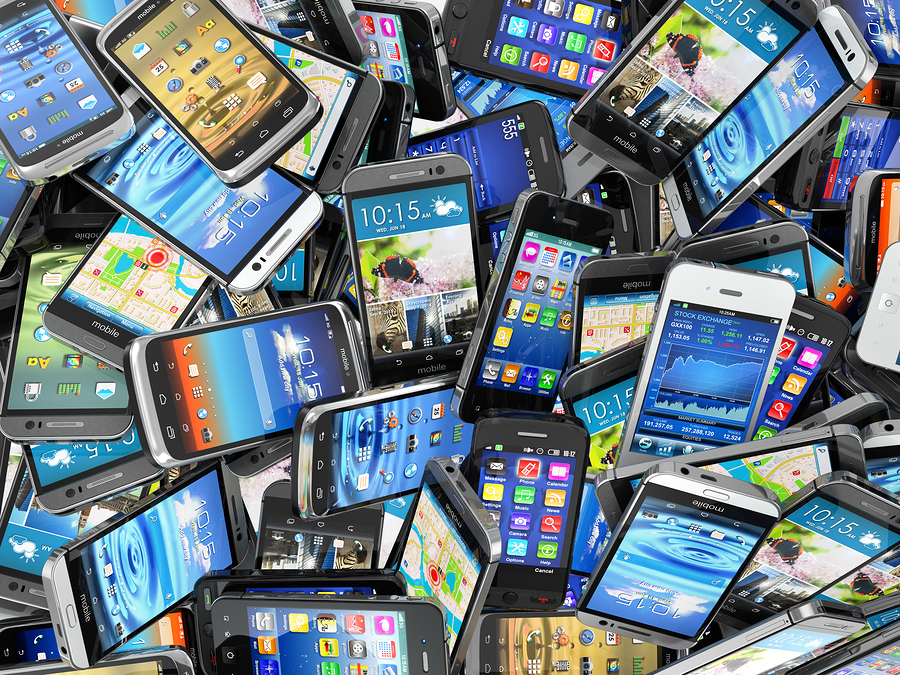 bigstock-Mobile-phones-background-Pile-75781594.jpg