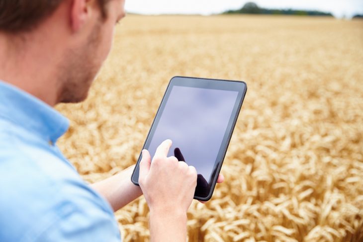 bigstock-Farmer-Using-Digital-Tablet-In-102522299.jpg