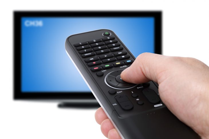 Hand-using-tv-remote-control-t-28811867.jpg
