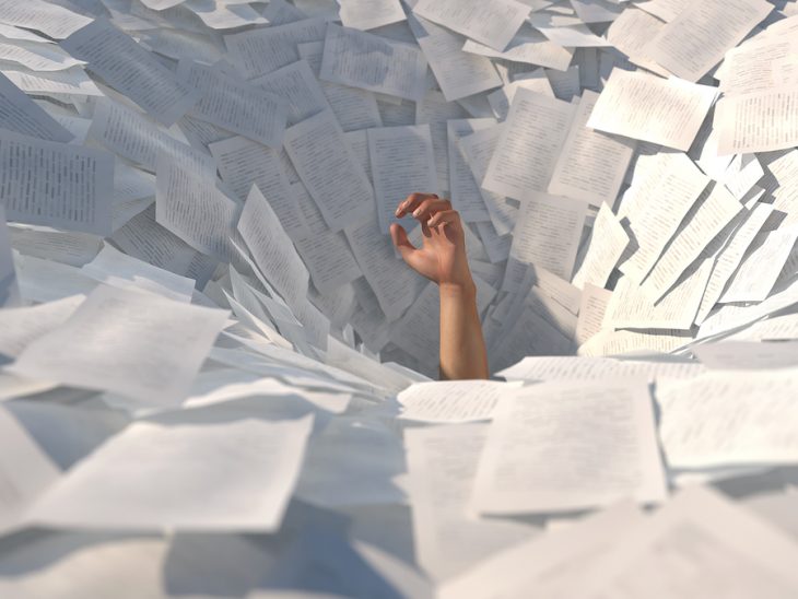 bigstock-hand-drowning-in-paper-sheets--176775346.jpg